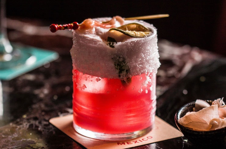 A bright pink cocktail.